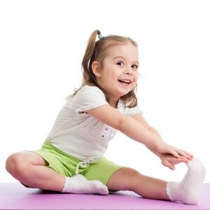 little girl touching toes